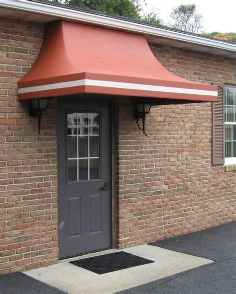 Concave Style Awning With Custom Stripe Edge Professionally Fabricated