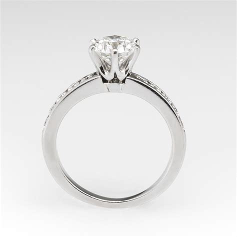 A White Gold Engagement Ring With Diamonds On The Side