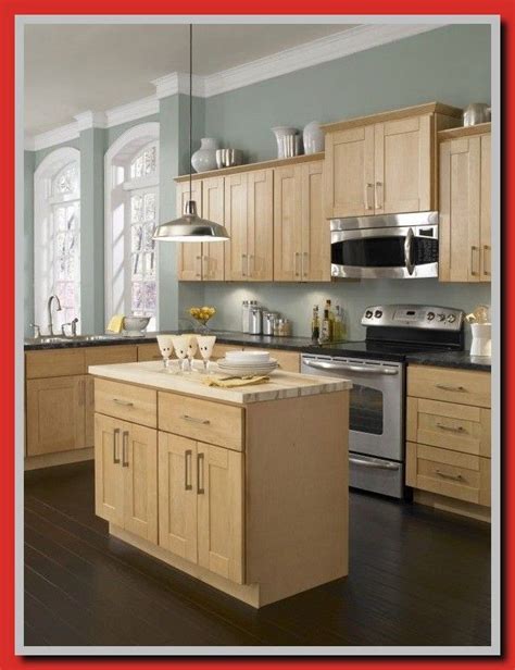 Dark cabinets with glass door panels offer a great contrast natural wood island: kitchen paint colors light maple cabinets-#kitchen #paint ...
