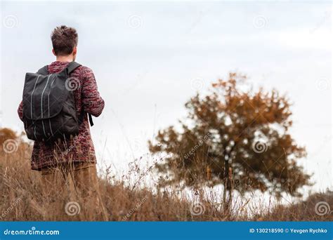 Young Man Tourist With Backpack Walking On Nature Stock Photo Image