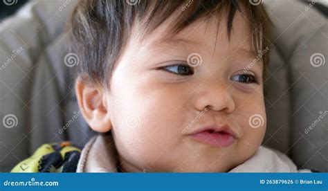 Closeup Of Cute Mixed Race Half Asian Baby Boy Smiling And Laughing