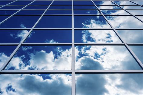 Glass Building With Clouds Reflection · Free Stock Photo