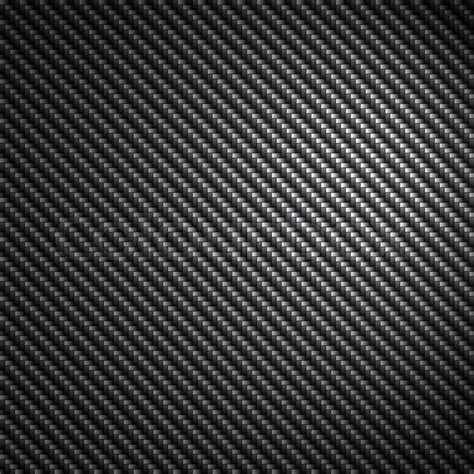 A Black Carbon Fiber Background Texture With Reflective Highlights