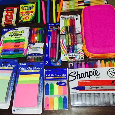 Various School Supplies Are Laid Out On A Table With Markers Pens And
