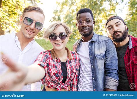 Group Portrait Of Multiethnic Friends Having Fun Together Outdoors