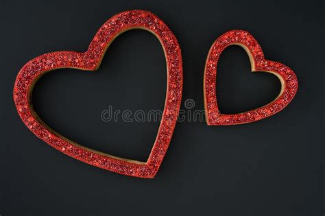 Two Sparkly Red Heart Shaped Frames On A Black Background Celebrating