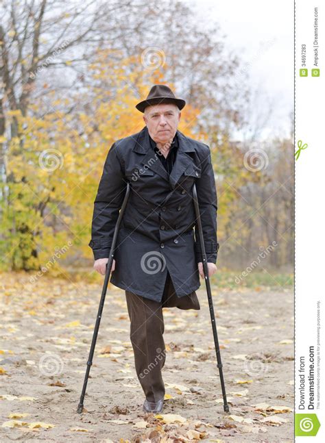 Disabled Senior Man On Crutches Stock Photos Image 34697283