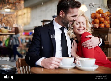 Couple Hugging In The Coffee Bar Stock Photo Alamy