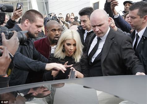 Kanye West Cant Resist A Cheeky Peek At Wife Kim Kardashians Cleavage