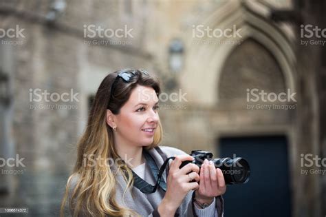 Girl Holding Camera And Photographing Stock Photo Download Image Now
