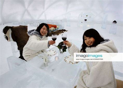 Sapporo Japan Women Demonstrate An Ice Hotel Facility Located Inside A Dome Made Of Ice At The