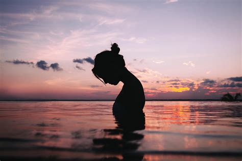 Silhouette Of A Woman In Body Of Water During Sunset Girl Silhouette Sunset Graphy Hd Wallpaper