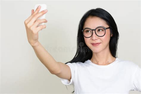 Portrait Of Young Beautiful Asian Nerd Woman Taking Selfie Stock Image