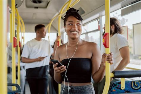 Premium Photo Smiling Woman In Good Mood Rides Bus To School In Morning Headphones In Ears