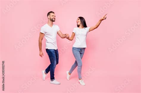 Full Length Body Size Photo Of Couple Wearing Jeans With Girlfriend