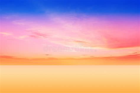 Cloudy Sunset And Sun Beam On Blue Pink Sky Yellow Clouds Skyline