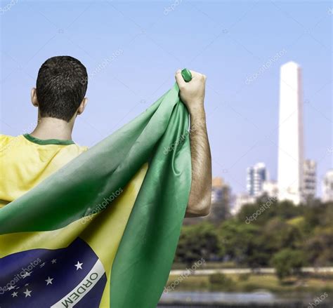 Homem Segurando A Bandeira Do Brasil Stock Photo Filipefrazao