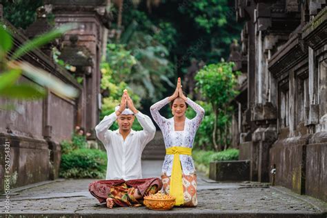 Balinese Couple Do The Prayer To God In The Morning Hindu People Make