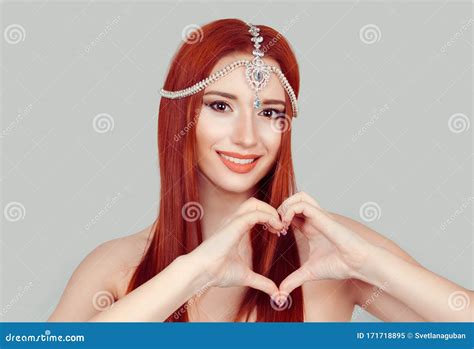 Love And Care Pretty Romantic Young Redhead Woman Making A Heart