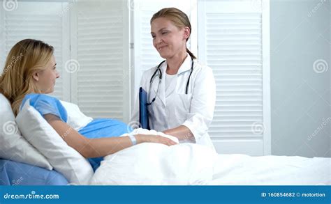 Professional Doctor Touching Pregnant Woman Tummy Checking Baby