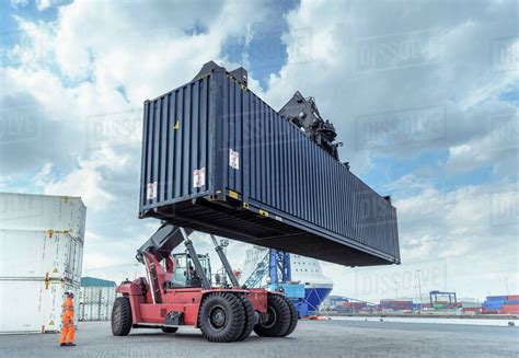 Container Lift With Shipping Container In Port Stock Photo Dissolve