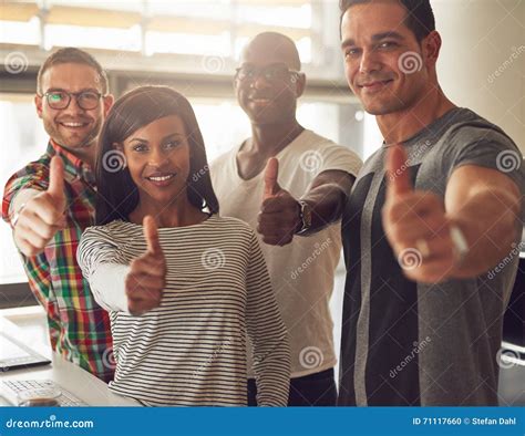 Four Small Business Owners With Thumbs Up Stock Photo Image Of