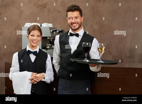 Waiter And Waitress Serving Drinks In A Hotel Restaurant Stock Photo Alamy