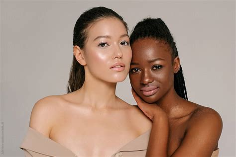 sensual multiethnic women with perfect skin in stylish makeup by stocksy contributor julie