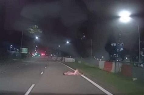 Man Arrested After Video Shows Him Naked Lying On Road In Sembawang