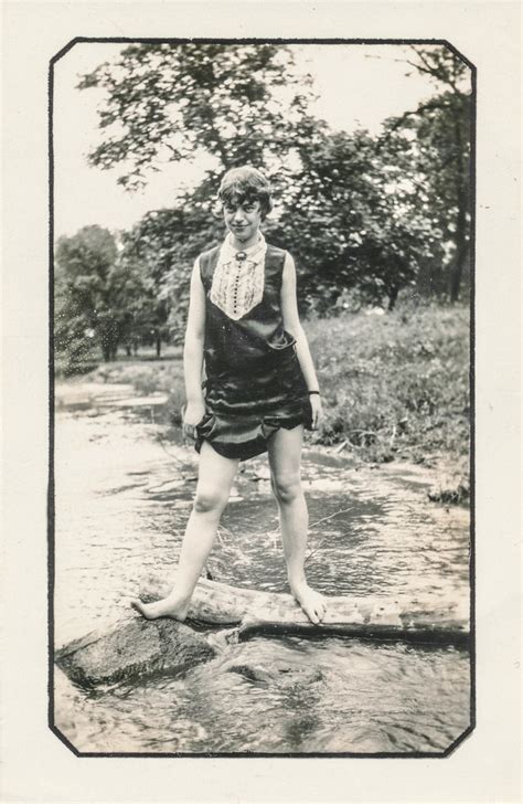 Woman Stands In A Creek With Her Dress Hiked Up Undated