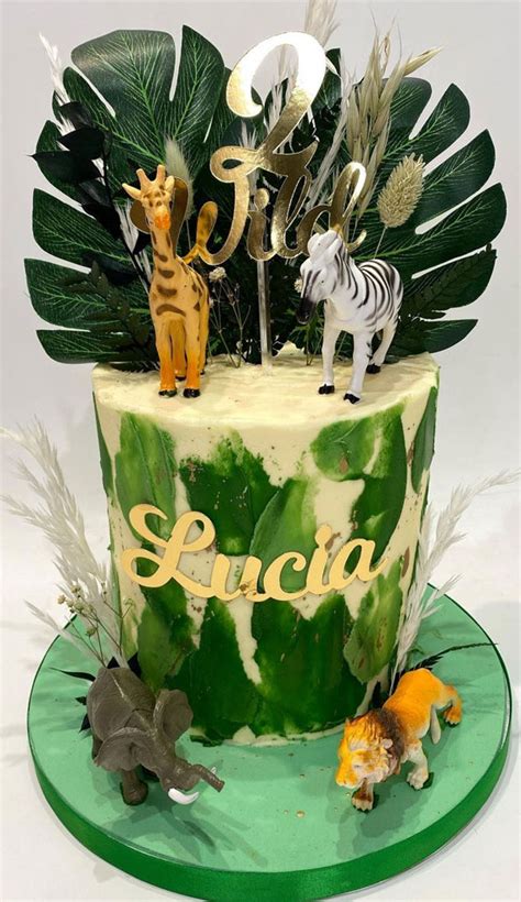 34 two wild birthday cake ideas green cake topped with tropical leaves