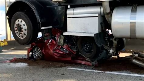 Woman Survives Car Being Flattened By Semi Truck Crawls Out Window In