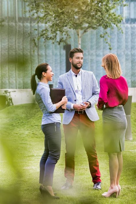Business People Discussing Plans On Meeting Outdoor Stock Photo Image