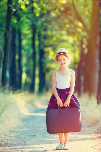 Premium Photo Girl With Suitcase