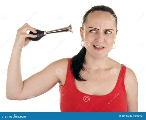 Женщина сжимая рожок в ее собственное ухо Стоковое Фото изображение насчитывающей девушка
