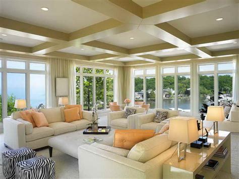 Adorable Soft Luxurious Florida Roomd Design With White Sofa And Orange Cushions And Storage With Table Lamps And Textured Ceiling With Lighting And Open Plan 