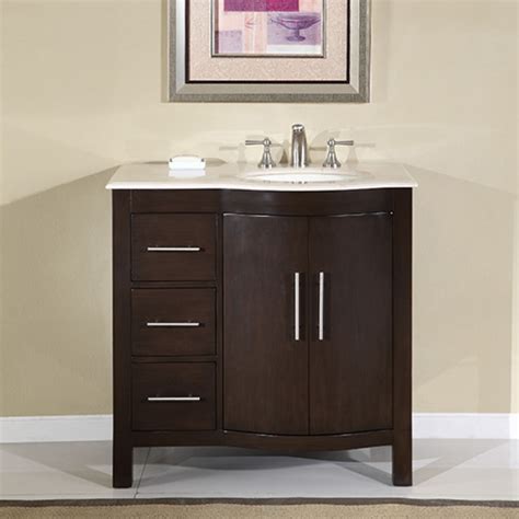 A vessel sink sits on top of the countertop. 36 Inch Modern Single Sink Bathroom Vanity with Marble
