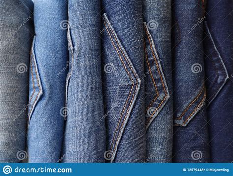 Row Of Blue Denim Jeans In A Variety Of Shades Stock Photo Image Of