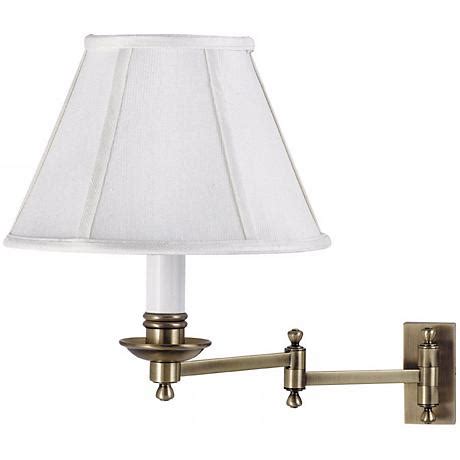 The light fixture's signature adjustable arm is coated in a brushed nickel finish and makes this wall light a favorite choice for when you want to read your favorite novel before bed. Antique Brass With Shade Plug-In Swing Arm Wall Lamp ...