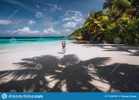 Travel Tourist Female Enjoy Exotic Tropical Beach With Palm Trees And