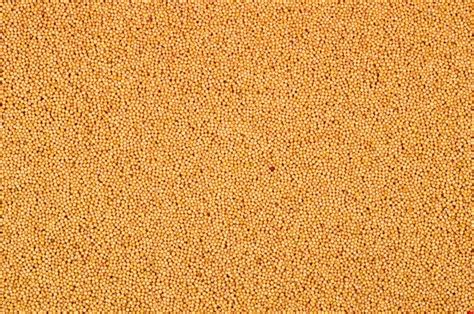 Premium Photo Yellow Mustard Seeds As A Background Texture