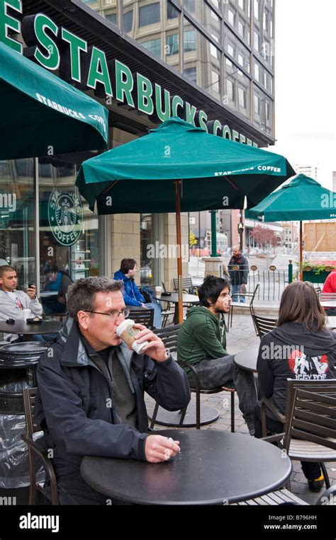Man Drinking Coffee At Starbucks Cafe In Downtown Montreal Stock Photo
