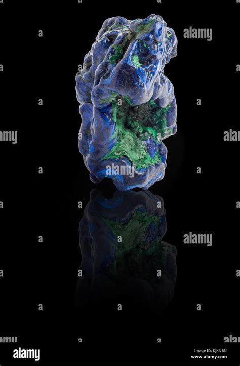 Blue And Green Azurite Gemstone With Ground Reflection On The Black