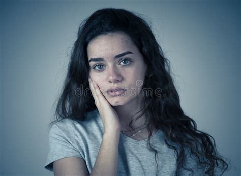 Close Up Portrait Of Teenager Female Suffering Depression Sad Face