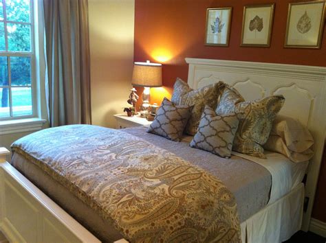 A circular mat and picture frames tie the hue further in. Autumn inspired guestroom designed by Daniel Berkeley ...