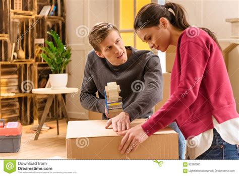 Young Couple Packing Things For Moving Home Stock Image Image Of Couple Moving 92292003