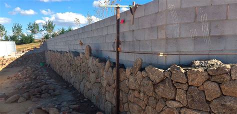 Retaining walls can be a great way not only to help with erosion and water drainage, but also to create beautiful, usable garden space. Grey Block Retaining Wall | Cowra Concrete Products