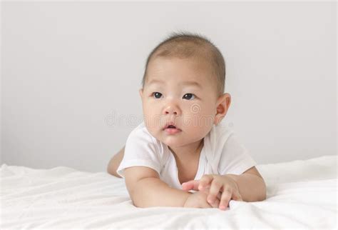 Baby Laying On Bed Looking Up Stock Image Image Of Portrait Lovely