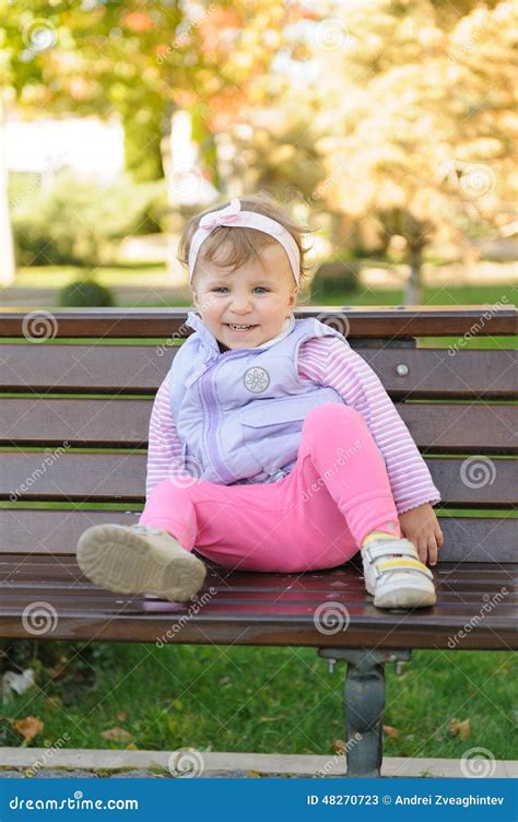 Smiling Girl On Bench Stock Image Image Of Blond Girl 48270723