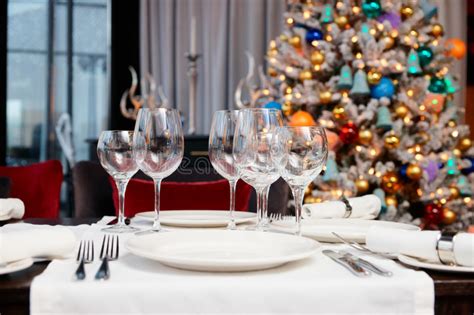 Place Setting With Christmas Tree In Background Stock Image Image Of